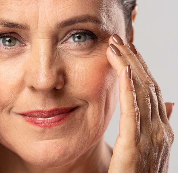 mature woman with make up posing with hand face 23 2148672322 1